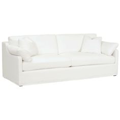 a white couch with pillows on top of it