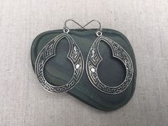 "Aren't these simply fabulous?! Brand new design. They are such unique boho statement earrings. The detail and cutout design is eye catching and so stylish. The earrings measure 1 7/8\" long by 1 3/8\" wide. They hang from simple silver ear wire hooks. Overall drop length is about 2\". Made from allergy free plated silver. Thanks for stopping by! Please take a moment and visit the rest of my Etsy shop. I have many more unique jewelry designs to choose from! 🌸 Tiger Flower Jewelry 🌸 🌸 Inspired Bohemian Teardrop Dangle Earrings With Oxidized Finish, Bohemian Teardrop Oxidized Earrings, Bohemian Oxidized Teardrop Dangle Earrings, Bohemian Silver Oxidized Teardrop Earrings, Bohemian Teardrop Earrings With Matching Pair, Bohemian Teardrop Plug Earrings As Gift, Bohemian Teardrop Plug Earrings, Bohemian Teardrop Plug Earrings For Gift, Bohemian Teardrop Nickel Free Hoop Earrings