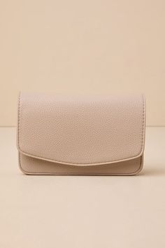 The Lulus Side to Side Taupe Crossbody Mini Bag is a timeless piece that will never go out of style! This small rectangular bag is shaped from pebbled vegan leather and features a structured, flat-bottom design. Open the front flap (with magnetic closure) to reveal a roomy lined interior, zippered compartment, multiple card slots, and a bonus front pocket. Carry with the convenient gold chain shoulder strap. Lined. Wallet Measures 7. 5" Wide, 5" Tall And 1. 5" Deep (Relaxed). 47. 5" Gold Chain S Rectangular Beige Belt Bag For On-the-go, Chic Soft Leather Rectangular Phone Bag, Chic Rectangular Soft Leather Phone Bag, Solid Rectangular Belt Bag For Daily Use, Versatile Soft Leather Rectangular Phone Bag, Everyday Rectangular Soft Leather Belt Bag, Elegant Rectangular Soft Leather Belt Bag, Versatile Beige Rectangular Belt Bag, Elegant Rectangular Belt Bag For On-the-go