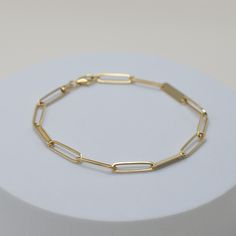 everyone's new favorite link, with an upgrade to 14k solid gold. introducing our much-loved Musha Link Bracelet - a new classic in a whole new light. the perfect addition to any outfit. its solid gold construction ensures a lifetime of wear and effortless style. fine 14k solid gold 2 grams 3.6mm thick lifetime warranty Classic Jubilee Chain Bracelet, Modern 14k Gold Bracelets For Everyday Luxury, Classic Link Bracelets With Solid Link Construction, Classic Jubilee Link Chain Bracelet, Classic Chain Bracelet With Solid Link Construction, Everyday White Gold Bracelet With Bracelet Strap, Luxury Everyday Bracelets With Box Chain, Everyday Tarnish Resistant Yellow Gold Sterling Silver Bracelet, Fine Jewelry Oval Link Chain Bracelet For Everyday