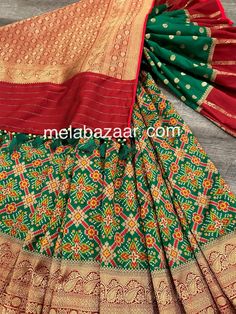 *Fine Silk Patola Saree! *Glamorous saree in green with patola weaving all throughout and Banarsi border *Matching blouse fabric included *Fall attached and designer tassels on the palla Note: The color of the products may slightly vary according to the ambient lighting conditions and the color calibration of LED devices. If you would like more clarity before your purchase, please drop us a message . Transitional Green Art Silk Sharara, Green Blouse Piece With Cutdana For Transitional Season, Transitional Green Blouse Piece With Cutdana, Festive Green Pre-draped Saree With Pallu, Green Art Silk Sharara With Cutdana, Festive Green Paithani Silk Pre-draped Saree, Festive Green Pre-draped Saree With Zari Weaving, Green Chanderi Choli For Transitional Season, Transitional Green Blouse Piece With Dupatta