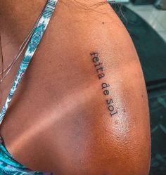 the back of a woman's shoulder with an inscription on it that says, let us