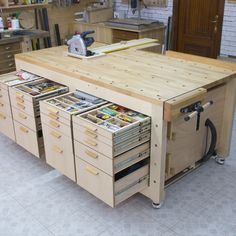 a workbench with lots of drawers and tools