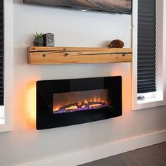 an electric fireplace in the corner of a room