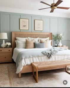 a bedroom with a bed, dressers and ceiling fan in it's center