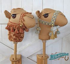 two stuffed camels are standing next to each other