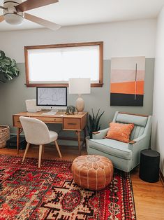 a living room filled with furniture and a rug