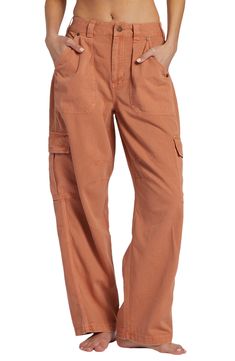 March to a utilitarian beat in these cargo pants cut from crisp cotton with a on-trend wide legs and plenty of pockets for all your daily essentials. 28" inseam; 18" leg opening; 12" front rise; 14" back rise (size 29) Zip fly with button closure Front slant pockets; back flap-patch pockets; cargo flap-patch pockets 100% cotton Machine wash, tumble dry Imported Cargo Pants Women High Waisted, Colorful Cargo Pants, Wide Leg Cargo Pants Outfit, Rust Colored Pants, Best Hiking Pants, Thrift List, Wide Leg Cargo Pants, Billabong Women, Thrift Shop