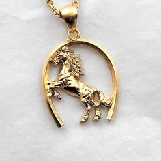 men's horse necklace pendant 1 made in 14k solid gold or 18k solid gold this necklace pendant is a horse with exquisite details in a horse's hoof. - pendant height is 28mm without the bail. - model wears a 2.1mm chain 50cm. - materials: 14k solid gold, 18k solid gold - designed by carre d'or - made in south korea 14k gold horse pendant necklace weight pendant only 7.66g (±5%) with a 2.1mm chain 42cm 13.62g (±5%) with a 2.4mm chain 42cm 15.49g (±5%) with a 3.0mm chain 42cm 19.24g (±5%) 18k gold h Mens Necklace Gold, Men's Necklace Gold, Man On Horse, Horse Pendant, Gold Horse, Horse Necklace, Mens Necklace, Horses Pendant, Mens Pendant