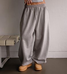 Wide leg. One Size. Side slant pockets Elastic waist. Elastic ankle  20% Polyester 80% Cotton Product Measurements: Waist 75cm / 29.5in Rise 40cm / 15.8in Length 104cm/40.9in Gray Sweatpants With Pockets For Loungewear, Gray Cotton Wide Leg Parachute Pants, Gray Wide Leg Cotton Parachute Pants, Baggy Wide Leg Joggers For Loungewear, Baggy Gray Pants For Leisure, Oversized Wide Leg Joggers For Loungewear, Oversized Cotton Lounging Pants, Gray Baggy Pants For Leisure, Oversized Sweatpants With Pockets For Lounging