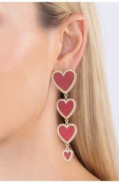 Gleaming goldtone beads frame a gradient chain of hearts on these statement drop earrings. Post back Goldtone plate, cubic zirconia Imported Jessica Rabbit Earrings, Heart Pattern Earrings, Gala Is Love Jewelry, Paul Valentine Earrings, Heart Face Earrings, Chain Of Hearts, Buying Gold, Link Earrings, Heart Dangle Earrings