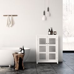 a white bath tub sitting next to a wooden table