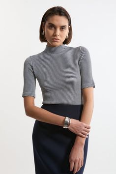 Feel Elevated In Our Knit Top, With A Universally Flattering, Fitted Silhouette, And A High, Funnel Neckline. Style This Piece With Jeans Or Tailored Trousers For An Outfit That Will Take You From Office Days To Wintery Walks, Then Pair With A Midi Skirt For More Elevated Occasions. Stripe Funnel Neck Short Sleeve Knit T-Shirt High Quality, Soft Knit Fabric High, Funnel Neckline Fine, Vertical Stripe Pattern Short, Flared Sleeves Comfortable, Figure Hugging Silhouette Knitted Short Sleeve Tops For Fall, Modern Fitted Crew Neck Sweater, Modern Fitted Fine Knit Top, Fitted Textured Knit Tops For Work, Textured Knit Fitted Tops For Workwear, Fine Knit Striped Tops For Spring, Striped Stretch Tops For Work, Stretch Striped Tops For Work, Chic Striped Fitted Sweater