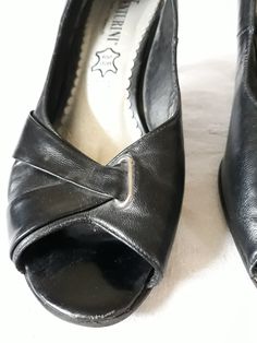 "Vintage leather black shoes/sandals. Peep toes summer pumps. Elegant Women`s pumps. Women size EU 38. Italian designer quality. Elegant interesting stiletto heels pumps. Women size 38 italian shoes. Made in Italy. Looks absolutely super on a foot. Really great looking, high quality shoes for elegant look. Brand: Venturini condition: Normal vintage condition. On the shoes back and heels are scratches, photo No.10. Heels height 7,5 cm / 2.9\" in Outsole length- 25,5 cm / 9.9\" in Width at ball of Classic Open Toe Kitten Heels With 4-inch Heel, Summer Open Toe Court Shoes With 4-inch Heel, Classic Black Kitten Heels For Summer, Classic Open Toe Kitten Heels For Party, Classic Open Toe Kitten Heels For Evening, Classic Open Toe Kitten Heels For Summer, Classic Summer Open Toe Kitten Heels, Formal Open Toe Medium Width Kitten Heels, Medium Width Open Toe Kitten Heels For Formal Occasions