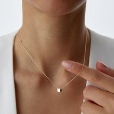 14K Solid Gold Little Gold Vermeil Cube Necklace Elevate your style with our 14K Solid Gold Little Gold Vermeil Cube Necklace - a dainty and minimalist piece that adds a touch of elegance to any outfit. This geometric necklace features a petite cube charm, expertly crafted from high-quality gold vermeil, offering a chic and timeless look. Details: Material: 14K Solid Gold Pendant: Gold Vermeil Cube Chain Length: Varies Style: Minimalist, Geometric, Dainty Perfect for layering or wearing alone, t Minimalist Jewelry With Delicate Chain And Square Pendant, Minimalist Jewelry With Delicate Square Pendant, Minimalist Yellow Gold Clavicle Chain Necklace, Minimalist Yellow Gold Clavicle Necklace, Modern Necklace With Square Pendant And Delicate Chain, Minimalist 14k Gold Necklace With Adjustable Chain, Minimalist Everyday Jewelry With Square Pendant, Modern 14k Gold Square Pendant Jewelry, Minimalist Yellow Gold Square Pendant Jewelry