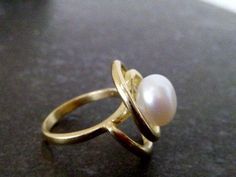 This ring features a delicate Natural Pearl set in 14k gold filled ring. => Pearl- Natural Pearl => Pearl size - 9mm => Metal Type - 14k Gold Filled (Tarnish Resistant And Nickel Free) My another shops on Etsy http://www.CandySimpleJewelry.etsy.com http://www.CandyCrystalsJewelry.etsy.com Important information **My customer service is available 7 days a week ** All jewelry items will come to you nicely packaged inside a fancy gift box. Optional Replacements / Custom Orders: ------------ Elegant 14k Gold Wire Wrapped Rings, Handmade Minimalist Pearl Ring For Wedding, Handmade 14k Gold Pearl Ring, Minimalist Handmade Pearl Wedding Ring, Elegant Adjustable Wire Wrapped Pearl Ring, Handmade Gold Pearl Promise Ring, Wire Wrapped Pearl Wedding Ring, Gold Wire Wrapped Pearl Ring Gift, Elegant Wire Wrapped Pearl Ring For Wedding