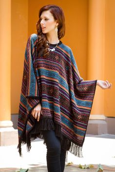 By Ana Fernandez this elegant poncho is knit of luxurious alpaca wool renowned for its lightweight warmth. Colorful and intricate geometric motifs are inspired by Mercedes Sosa's interpretation of Gracias a la vida a song by Chile's Violeta Parra. Alpaca Poncho, Color Block Shirts, Ladies Poncho, Wool Poncho, Poncho Pattern, Knitted Poncho, Ladies Dress Design, One Piece Swimwear, Vintage Colors