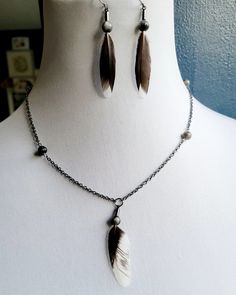 Olandsk Dwarf small wing feathers with larvakite beads. This is a set, necklace and earrings. Necklace length 20 inches. Earings roughly a little over 2 inches and come with rubber backings. Feathers are collected, cleaned and sterilized by the @thewildehearted before creating. Do not get wet, if you get wet let dry out completely and brush with a dry tooth brush. Do not put your necklace in your pocket. Wing Feathers, Small Wing, Feather Pendant Necklace, Tooth Brush, Feather Pendant, Set Necklace, Necklace And Earrings, Necklace Length, Handmade Necklaces