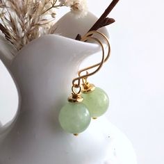 "6662 Green Jade Earrings natural stone dangle drops simple modern everyday casual boho chic gold plate birthday anniversary Valentine's day Mother's day Christmas stuffing stockings holiday gift for her women mom sister wife girlfriend daughter niece aunt grandma cousin colleague best friend. Enjoy the beauty & power of natural gemstones. MATERIALS & DIMENSIONS ✦ Natural JADE, light green, smooth round beads 10mm; ✦ GOLD Plated pins, spacers and handmade fish hook ear wires; ✦ The total length Trendy Gold Jewelry With Natural Stones, Elegant Everyday Jade Jewelry, Gold Hypoallergenic Jade Earrings, Hypoallergenic Gold Jade Earrings, Everyday Gold Jade Jewelry, Elegant Green Earrings For Mother's Day, Everyday Dangle Earrings With Natural Stones, Minimalist Gold Jade Jewelry, Modern Gold Earrings For May Birthstone