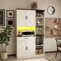 a kitchen area with a microwave, potted plant and other items on the shelves