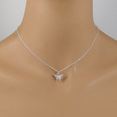 This beautiful crystal butterfly necklace is made with a dainty silver-plated crystal encrusted butterfly pendant and is suspended on a sterling silver chain with a sterling silver clasp. The necklace is available in five necklace lengths, please choose the necklace length you need from the drop-down menu. The necklace will arrive in an attractive gift box. Dainty Silver Butterfly Necklace For Wedding, Delicate Silver Butterfly Necklace With Clavicle Chain, Silver Butterfly Necklace With Clavicle Chain, Silver Delicate Butterfly Necklace, Delicate Silver Butterfly Necklace, Silver Butterfly Necklace With Delicate Chain, Silver Delicate Butterfly Necklace With Delicate Chain, Elegant Sterling Silver Butterfly Necklace With Butterfly Clasp, Silver Sterling Butterfly Necklace With Clavicle Chain