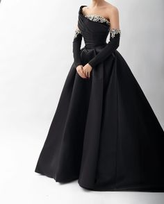 Experience elegance and glamour in our Dreamy Vow one shoulder evening dress. Made with luxurious black satin and embellished with sparkling crystals, this dress exudes sophistication and style. Perfect for any special occasion, it will make you stand out and feel confident. window.adminAccountId=244214477; Embellished Ball Gown For Prom Season Evenings, Satin Ball Gown With Sweep Train For Evening, Black Gown With Asymmetrical Neckline For Prom, Black Prom Gown With Asymmetrical Neckline, Satin Ball Gown For Evening Gala, Black One-shoulder Floor-length Prom Dress, Black Embellished Dress With Asymmetrical Neckline, Elegant Off-shoulder Ball Gown For Formal Events, Black One Shoulder Floor-length Dress For Prom