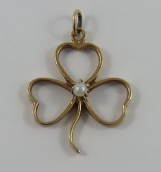 "This is a vintage \"Three Leaf Clover With White Stone\" 14 karat gold charm for a charm bracelet.  It weighs 2.75 grams and measures 7/8\" x 1 1/8\", marked \"14K\" All charms come with a split ring to attach to a bracelet. We have hundreds of charms in stock. If you don't see what you are looking for in our shop please contact us as it is likely we have it. Inventory #G4916" Vintage 14k Gold Jewelry With Charms, Victorian Jewelry In 14k Gold With Hallmark, Victorian 14k Gold Jewelry With Hallmark, Classic 14k Gold Jewelry With Vintage Charm, Elegant 14k Gold Charms For Collectors, Elegant Hallmarked Charms For Collectors, Elegant 14k Gold Collectible Charms, Classic Collectible Charms Jewelry, Elegant Vintage Charm For Anniversary