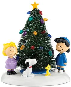 peanuts around the christmas tree figurine with charlie brown and snoopy on it