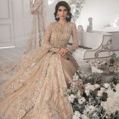 Beige Bridal Lehenga Maxi for Pakistani Wedding Dresses is an attractive dress to wear at the walima. This breathtaking attire is gracefully embellished with beige maxi lehenga and adornments giving a dreamy look to the Bride. The premium quality fabric of this perfectly stitched attire makes this Traditional Bridal Dress your foremost priority. Beige Lehenga Gown: Walking into a new chapter of your life with the joy of togetherness and the magic of love. NameerabyFarooq presents a walima outfit Cream Sharara For Wedding And Eid, Cream Sharara For Wedding On Eid, Hand Embellished Floor-length Wedding Dress For Reception, Gold Wedding Dress With Dabka Work, Intricate Embroidered Floor-length Wedding Dress For Reception, Intricately Embroidered Floor-length Wedding Dress For Reception, Floor-length Wedding Dress With Intricate Embroidery For Reception, Intricate Embroidery Floor-length Wedding Dress For Reception, Bollywood Style Floor-length Hand Embellished Wedding Dress