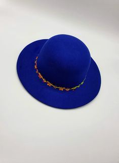 "Kids always love a hat, especially a fun hat like this one! The vacation mood is on This beautiful hat is so stylish and chic, girls will love it. A perfect royal blue wide brim hat for girls is waiting for you to purchase for special occasions autumn or everyday events. A great gift for toddlers!! It's made out of felt and is suited for winter days as well as fall or spring. There are beautiful flowers and butterflies attached to the hat. In each of the flowers and butterflies, there is a shin Toddler Winter Hat, Hat For Kids, Vacation Mood, Toddler Winter, Childrens Hats, Blue Hat, Beautiful Hats, Cool Hats, Skull Cap Beanie