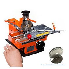 a hand holding a circular saw next to a machine