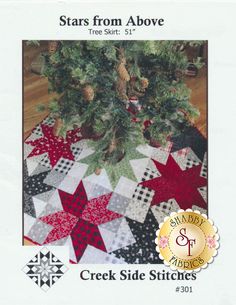 a christmas tree skirt is featured in the front cover of this book, stars from above