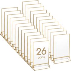 PRICES MAY VARY. Package including: the package includes 26 pieces acrylic sign holders with gold border, can display 5 x 7 inch documents or pictures, sufficient quantity can fully display any items you want to display; This gold menu holder combines modern glam with a touch of romantic vibe, which added a touch of classic elegance to any table Strong Quality: our clear double sided menu holder is made of acrylic, designed with gold edges to add an elegant touch to your tables; It appears to be Gold Table Number Holders, Table Display Stand, Wedding Table Number Holders, Table Number Holder, Acrylic Picture Frames, Gold Table Numbers, Gold Picture Frame, Table Number Holders, Menu Holders