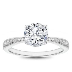 a diamond engagement ring with channeled shoulders