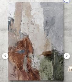 an abstract painting is displayed on the wall