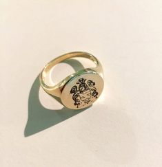 "Coat of Arms Family Crest Ring, Crest Engraved ring, Personalized Ring Engraved Signet ring with Round Seal - Best quality 18k Gold Plate also available in sterling silver - suitable for men and women, Diameter: 15 mm Please note in the \"notes to seller\" at checkout. : * state your ring size * letter/ picture you want to engrave The product will arrive to you packed in gift box and padded envelope to maintain the product For more rings from us: https://www.etsy.com/il-en/shop/Limajewelry?sect Men Pinky Ring, Pinky Ring Gold, Family Crest Ring, Engraved Signet Ring, Family Crest Rings, Custom Signet Ring, Engraved Ring, Letter Ring, Personalized Ring