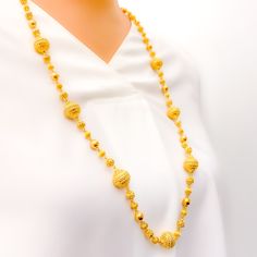 This handmade chain is a celebration of craftsmanship and tradition, made from 22k yellow gold that adds a warm, radiant glow to any attire. Weighing 60.0 grams, it boasts a substantial presence, signifying its high quality and durability. The chain extends over a length of 30 inches, adorned with beads that reach up to 13.25 mm in width, providing a striking visual impact. It features 1.7 inches of adjustable links, offering versatility and a personalized fit, complemented by a secure hook lock