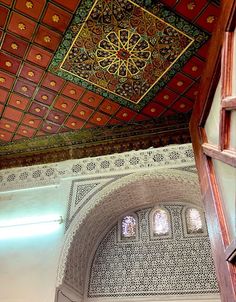 an ornate ceiling in the middle of a building