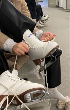 a person sitting in a chair with some shoes