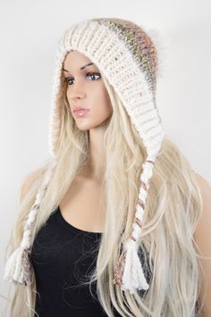 a blonde wig wearing a white knitted hat