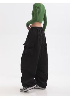 Features: Introducing the Women Punk Cargo Pants, perfect for the fashion-forward. Designed with a high waist and wide leg, these pants not only provide a flattering fit but also add a touch of streetwear edge to your wardrobe. Made with lightweight material, these pants are perfect for the summer season. Upgrade your style with these American Retro-inspired trousers. Y2k Baggy Full-length Bottoms, Baggy Y2k Full-length Pants, Y2k Style Baggy Full Length Pants, Y2k Full-length Baggy Pants, Y2k Wide-leg Pants With Pockets, Y2k Baggy Wide-leg Pants, Y2k Style Baggy Wide-leg Pants, Black Y2k Style Trousers, Black Baggy Y2k Parachute Pants