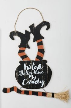 Burlap loop for easy hanging. Distressed wood. Sign has attached hanging broom made of wood and straw. Worth Imports Hanging Witch Halloween Decor - Distressed Wood Sign with Attached Broom | 8347 Witch Halloween Decor, Hanging Witch, Witch Signs, Distressed Wood Signs, Halloween Witch Decorations, Witch Design, Halloween Wall Decor, Halloween Wall Art, Accent Wall Decor