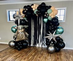 a star wars balloon arch with black and silver balloons