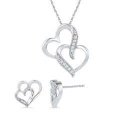 Take her breath away with this double diamond heart gift set that includes a stunning necklace pendant and matching earrings. Intertwined diamond hearts are symbolic of your love and togetherness. These double heart earrings and necklace are fashioned in sterling silver while each features one larger open heart and a smaller heart glittering with diamonds. These items can be purchased separately:Double Heart Necklace (SKU SHPH017151-SS)Double Heart Earrings (SKU SHEF073362ATW-SS) DETAILS OF THE Diamond Heart Jewelry, Heart Jewelry Set, Double Heart Necklace, Double Diamond, Earrings And Necklace, Double Heart, Heart Gifts, Open Heart, Small Heart