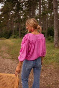 The lightweight Pink Eddie Shirt features pleated fabric on the front and 7/8th balloon sleeves, made from incredibly soft material for a flowy fit. The shirt also includes a button placket for easy closure. This shirt also comes in Beige Our model is also wearing the Blue Maddie Jeans One size (fits from US sizes 2-8) Length 26.4 in - Width 35.4 in 100% Cotton Washing: handwash Spring Button-up Tops With Gathered Sleeves, Casual Lantern Sleeve Blouse With Relaxed Fit, Relaxed Fit Button-up Blouse With Gathered Sleeves, Relaxed Fit Button-up Tops With Gathered Sleeves, Relaxed Fit Tops With Gathered Sleeves And Button-up, Relaxed Fit Blouse With Gathered Sleeves And Button-up, Casual Tops With Bishop Sleeves For Summer, Summer Daywear Tops With Bishop Sleeves, Casual Bishop Sleeve Tops For Summer