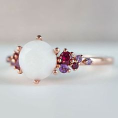 Beautiful handmade item! Here, on Etsy made as simulation only-just resin and white color.  Breastmilk Ring made with white gold plated sterling silver or plated with rose or yellow gold. Opal effect breastmik 7mm diamond shaped stone. Any size available. Rose gold,  or white gold plated options.  Pearl powder or opal effect can be added to this fine breastmilk ring.  Symbolic of the little diamond you brought into this world, our breastmilk stone ring shines bright. Beautiful inlaid cubic zirconia surround and accentuate your breastmilk stone while a skin-friendly 925 sterling silver ring core.  To see our full breastmilk Ring collection, please click here: https://www.etsy.com/ca/shop/KeepsakeMom?ref=simple-shop-header-name&listing_id=1095328032&section_id=24695275 To see All our items, White Opal Jewelry Gift, White Enamel Open Ring For Anniversary, White Moonstone Ring In 14k Gold For Promise, White Moonstone Promise Ring In 14k Gold, White 14k Gold Moonstone Promise Ring, Unique White Multi-stone Moonstone Ring, Elegant White Enamel Ring For Gift, White Opal Birthstone Jewelry, Dainty White Opal Jewelry