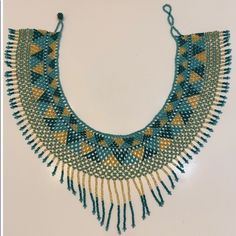 New Broad Collar Beaded Necklace. The Beautiful Colors Of This Piece Will Enhance Any Of Your Outfits. It Is A Beautiful, Highly Detailed Accessory That Will Have Everyone Look At Itegyptian Style. Bohemian Turquoise Bib Necklace With Colorful Beads, Handmade Turquoise Bib Necklace With Adjustable Fit, Handmade Adjustable Turquoise Bib Necklace, Adjustable Turquoise Beaded Bib Necklace, Beaded Turquoise Necklace With Round Beads For Festival, Beaded Turquoise Necklace For Festival, Handmade Turquoise Bohemian Bib Necklace, Festival Beaded Turquoise Necklace, Festival Turquoise Necklace With Round Beaded Details