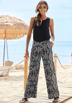 Embrace the artistry of fashion with our eye-catching wide-leg printed pants. Printed Wide-leg Pants For Vacation, Chic Printed Ankle-length Wide Leg Pants, Printed Wide Leg Pants For Vacation, Chic Ankle-length Printed Wide Leg Pants, Printed High-waisted Wide Leg Summer Pants, Chic Printed Pants For Summer, Printed High-waisted Wide Leg Pants For Vacation, Chic Patterned Bottoms For Vacation, Patterned Wide Leg Beach Bottoms