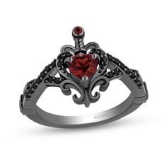 Sweet yet dark, this Enchanted Disney Villains ring inspired by the Evil Queen reflects your unique style. Sterling silver with black rhodium plate A garnet-touched dagger pierces through the 5.0mm heart-shaped red garnet Black diamonds adorn the frame and line the crossover split shank Sculpted scrolling ribbons add decorative detail 1/5 ct. t.w. of diamonds ©Disney Gothic Wedding Rings, Gothic Engagement Ring, Black Gold Wedding, Red Stone Ring, Black Gold Jewelry, Black Wedding Rings, Pink Ruby, Gothic Rings, Black Ring