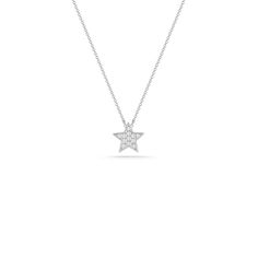 We're seeing stars! Our Julianne Himiko gold and diamond star necklace is what celestial dreams are made of. This single star pendant is adorned with pavé-set diamonds and hangs on a delicate diamond cut cable chain. Delicate and dainty, this charming necklace is perfect for layering. This is the must-have piece for all the Astrology lovers out there. It is available in 14k white, yellow, and rose gold with a spring-ring clasp and a sparkling mini-chain. The pendant is always white gold to show Fine Jewelry White Gold Necklace With Star Charm, Star Shaped Diamond Necklace With Single Cut Diamonds, Dainty Star Diamond Necklace, Dainty Diamond Star Necklace, Elegant White Gold Star Diamond Necklace, Diamond White Star Necklace With Single Cut Diamonds, White Gold Star Necklace Fine Jewelry, Diamond Star Charm Necklace, Luxury Star Necklace With Single Cut Diamonds